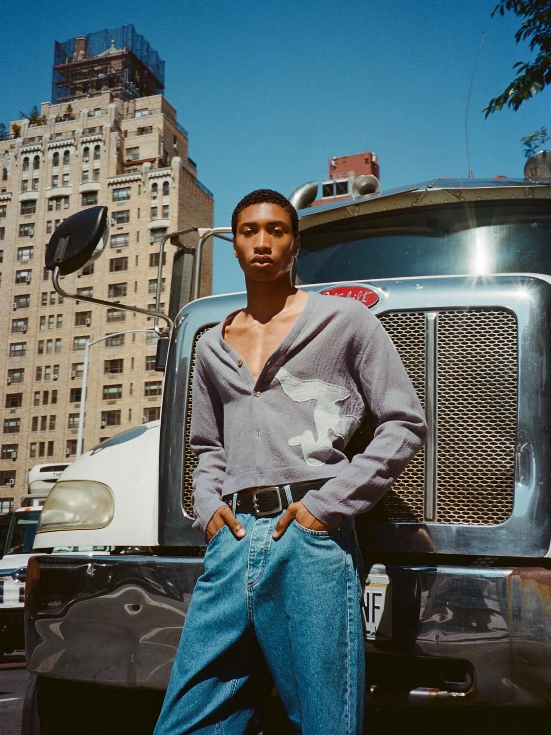 Portrait against a truck grille, New York
