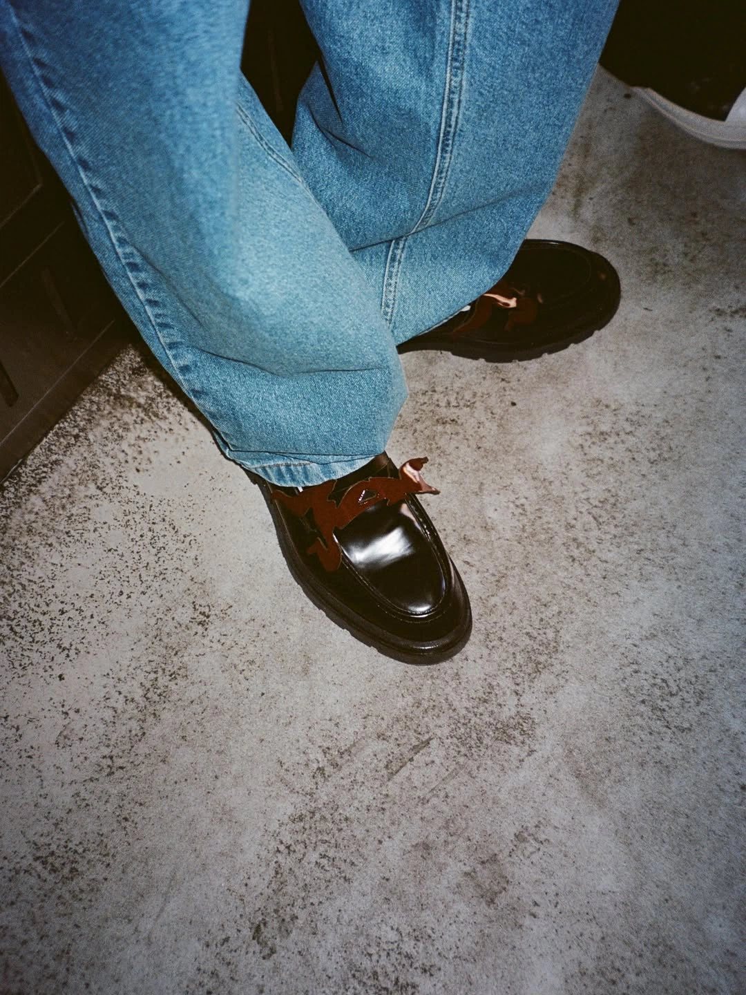 Loafers and denim, detail