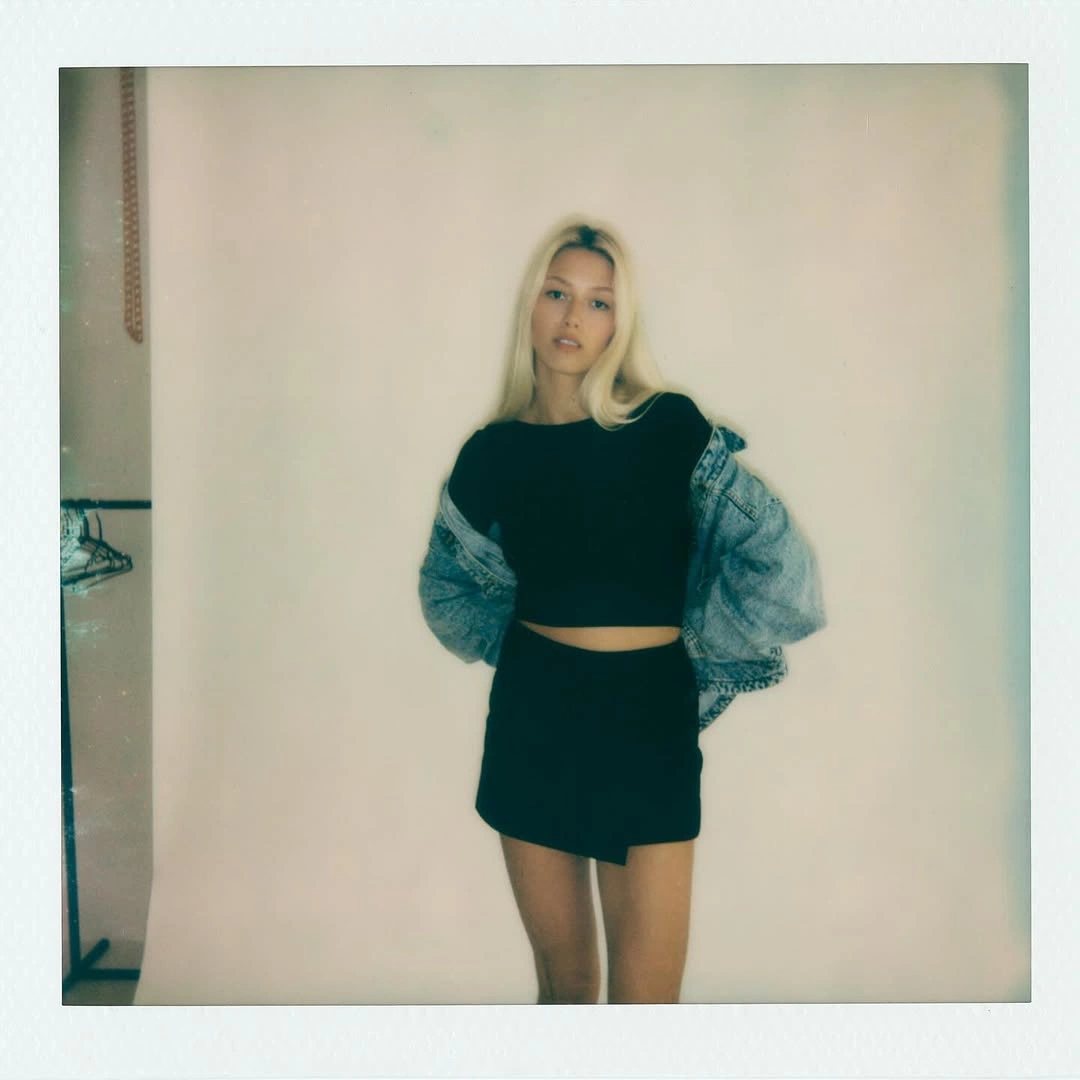 Polaroid — denim jacket, studio